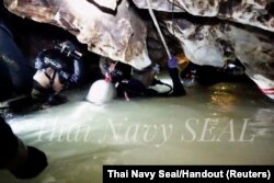 Rescue personnel work at the Tham Luang cave complex, as members of an under-16 soccer team and their coach have been found alive according to local media, in the northern province of Chiang Rai, Thailand, July 4, 2018.