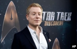 FILE - Anthony Rapp, cast member in "Star Trek: Discovery," poses at the premiere of the new television series in Los Angeles, Sept. 19, 2017.