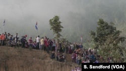 Ethnic Karen villagers and refugees watch the Karen Revolution day military parade Jan. 31, 2019, in Karen state, Myanmar, near the Thai-Myanmar border.