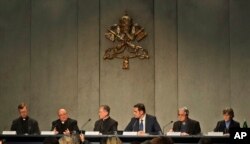 From left, Rev. Hans Zollner, Mons. Charles Scicluna, Cardinal Blase J. Cupich, Vatican Spokesperson Alessandro Gisotti, Rev. Federico Lombardi and Sister Bernadette Reis give a press conference on a Vatican summit on preventing clergy sex abuse, at the Vatican, Feb. 18, 2019.