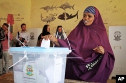 A woman casts her vote in the presidential election in Hargeisa, in the semi-autonomous region of Somaliland, Nov. 13, 2017.