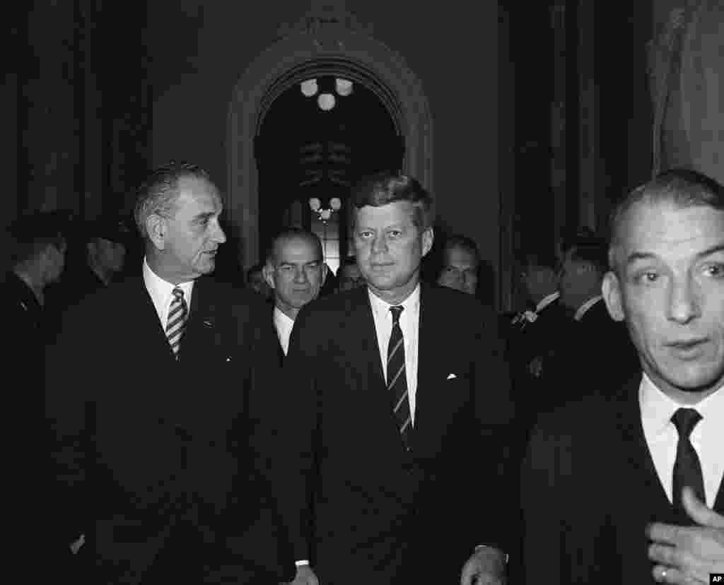President John F. Kennedy walks through the halls of the Capitol after delivering his State of the Union address, Jan. 30, 1961.
