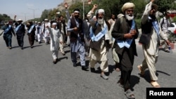 FILE - Afghan peace marchers arrive in Kabul, Afghanistan, June 18, 2018.