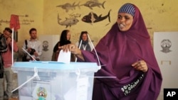 FILE - A woman casts her vote in the presidential election in Hargeisa, in the semiautonomous region of Somaliland, Nov. 13, 2017.