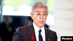 FILE - Japan's Foreign Minister Takeshi Iwaya arrives at Prime Minister Shigeru Ishiba's official residence in Tokyo, Oct. 1, 2024. 