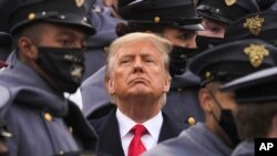Surrounded by Army cadets, President Donald Trump watches the first half of the 121st Army-Navy Football Game in Michie Stadium at the United States Military Academy, Dec. 12, 2020, in West Point, N.Y.