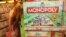 A woman inspects a display of the latest South African version of the world-famous Monopoly board game. (D. Taylor/ VOA)