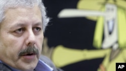 FILE - Lottery vendor Xavier Gabriel talks in his office in Sort, Spain, Nov. 3, 2006. Gabriel has joined more than 1,500 companies that have moved their headquarters out of Catalonia, fearing they would no longer be covered by Spanish or European Union laws if Catalonia breaks away.