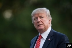 President Donald Trump walks from Marine One across the South Lawn of the White House in Washington, Aug. 23, 2017, as he returns from Reno, Nev.