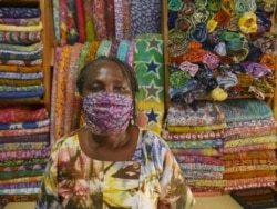 Batik producer Esther Amate worries about the counterfeit fabrics in the market and says COVID-19 shows the need to support local industries. (Stacey Knott/VOA)
