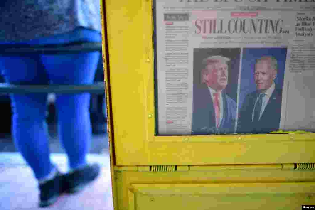 A newspaper&#39;s front headline states &quot;Still Counting...&quot; after Democratic presidential nominee Joe Biden overtook President Donald Trump in the Pennsylvania general election vote count, in Philadelphia, Pennsylvania, Nov. 6, 2020.