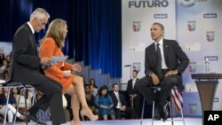 President Barack Obama participates in a town hall hosted by Univision and Univision news anchors Jorge Ramos (L) and Maria Elena Salinas (C), at the University of Miami, Florida, September 20, 2012.