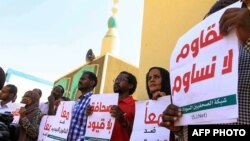 FILE - Sudanese journalists protest against a proposed press law at the National Council for Press and Publications, in Khartoum, Nov. 15, 2017. Local journalists say recent moves by the government and military hint at a return to more repressive times.