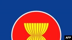 Massunguna of Angola fights for the ball with Ibrahim of Sudan during their African Nations Cup soccer match in Malabo