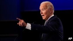 Democratic presidential candidate former Vice President Joe Biden gestures while speaking during the first presidential debate Tuesday, Sept. 29, 2020, at Case Western University and Cleveland Clinic, in Cleveland, Ohio. (AP Photo/Julio Cortez)