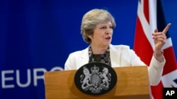 FILE - British Prime Minister Theresa May Theresa May speaks during a media conference at an EU summit in Brussels on Oct. 20, 2017.