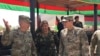 FILE - In this Aug. 20, 2017, photo, U.S. Gen. John Nicholson, top U.S. commander in Afghanistan, left, talks with Col. Khanullah Shuja, commander of the Afghan special operations force, and U.S. Gen. Joseph Votel, head of U.S. Central Command, at Camp Morehead in Afghanistan. 