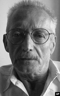 FILE - Ron Abney, an American, was working to promote democracy in Cambodia when he was wounded in a March 30, 1997, grenade attack.