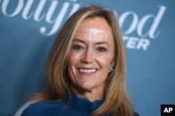 FILE - Karey Burke arrives at The Hollywood Reporter's Women in Entertainment Breakfast at Milk Studios in Los Angeles, Dec. 5, 2018.