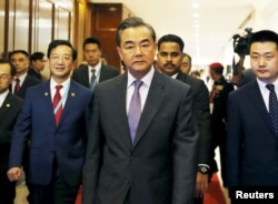 China's Foreign Minister Wang Yi arrives at a meeting during the 48th Association of Southeast Asian Nations (ASEAN) foreign ministers meeting in Kuala Lumpur, Malaysia, Aug. 4, 2015.