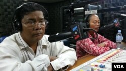 Mr. Chan Soveth, left, Department Chief of Investigation Unit of Adhoc and Mrs. Un Sophy, a representative of Lor Peang Community in Kampong Chhnang province. 