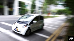 An autonomous vehicle is driven during its test drive in Singapore Wednesday, Aug. 24, 2016.
