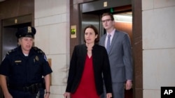 Former White House advisor on Russia, Fiona Hill, arrives on Capitol Hill in Washington, Oct. 14, 2019, as she is scheduled to testify before congressional lawmakers as part of the House impeachment inquiry into President Donald Trump.