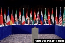 U.S. Secretary of State John Kerry sits with Russian Foreign Minister Sergey Lavrov, United Nations Special Envoy for Syria Staffan de Mistura, and United Nations Deputy Secretary-General Jan Eliasson on Feb. 11, 2016, at the Hilton Hotel join Munich, Ger