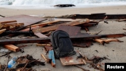 A view of the wreckage of a shipwreck in southern Italy which has left dozens of migrants dead after the boat in which they were travelling smashed onto the rocks, in Cutro, Italy, Feb. 27, 2023. 