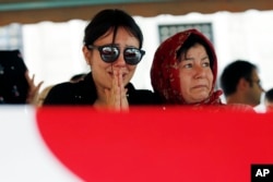Family members and friends attend the funeral prayer for Gulsen Bahadir, 28, a Turkish Airlines (THY) flight attendant killed Tuesday at the blasts at Ataturk airport, in Istanbul, June 29, 2016.