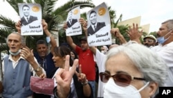 People gather in a show of support to Khaled Drareni,outside the court house Tuesday, Sept.8, 2020 in Algiers. Drareni was imprisoned Aug. 10 for "inciting an unarmed gathering" and "endangering national unity" linked to coverage of Algeria's Hirak…