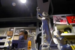 FILE - A small replica of the Goddess of Democracy is displayed at the June 4th Museum in Hong Kong, May 20, 2020.