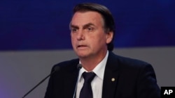Jair Bolsonaro, who is running for president from the National Social Liberal Party, attends a presidential debate in Sao Paulo, Brazil, Aug. 9, 2018. Brazil will hold general elections on Oct. 7.