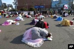 South Korean Christians pray for reunification in Seoul, South Korea, Jan. 1, 2019. North Korean leader Kim Jong Un said Tuesday he hopes to extend his nuclear summitry with President Donald Trump into 2019, but also warned Washington not to test North Koreans' patience with sanctions and pressure.