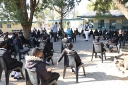 Learners in Gaborone practise social distancing while being addressed by their teachers on the opening day. (Photo: Mqondisi Dube)