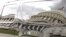 The U.S. Capitol is reflected in an SUV parked outside the Capitol in Washington, September 28, 2013.
