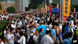 Pro-China supporters gather at a park during a counter-rally in support of the police in Hong Kong Saturday, July 20, 2019. (AP Photo/Vincent Yu)