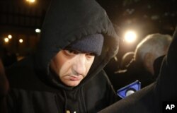 Chicago Police Officer Jason Van Dyke leaves the Cook County Jail after posting bond, Nov. 30, 2015. He has been jailed since Nov. 24, when prosecutors charged him with first-degree murder in the shooting death of Laquan McDonald.