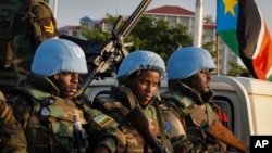U.N. peacekeepers from Rwanda wait to escort members of the U.N. Security Council as they arrive at the airport in Juba, South Sudan, Sept. 2, 2016. The envoys arrived Friday to press the government to allow another 4,000 peacekeepers into South Sudan. 