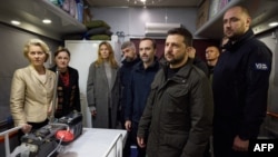 European Commission President Ursula von der Leyen, left, accompanied by Ukraine's President Volodymyr Zelenskyy, visits a railroad car equipped with medical equipment at the railway station in Kyiv. (Ukrainian Presidential Press Service via AFP)