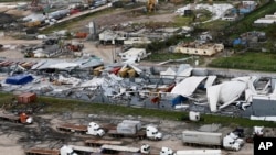 An aerial photo shows a damaged factory following the devastating Cyclone Idai in Beira, Mozambique, March 23, 2019. 