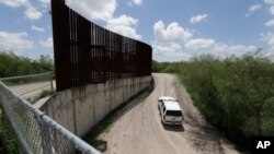 FILE - U.S. Customs and Border Patrol patrol along the border fence, June 27, 2018, in Hidalgo, Texas. A 16-year-old Guatemalan boy in U.S. Customs and Border Protection custody died on May 20, 2019.