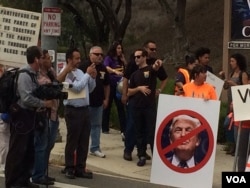 VOA reporter Mike O'Sullivan took this photo of protesters near the debate site while aboard the media shuttle bus.