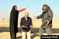 The Arta FM staff performs a mock IS-style execution. (Courtesy - Arta FM)