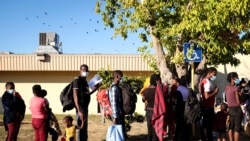 Migrants seeking asylum in the U.S. board a bus to Houston from Val Verde Border Humanitarian Coalition after being released from U.S. Customs and Border Protection, in Del Rio, Texas, Sept. 23, 2021.