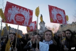 FILE - People take to the streets near Republique square to protest anti-Semitism, in Paris, France, Feb. 19, 2019.
