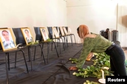 FILE - A member of the Ethiopian Airline Pilots' Association mourns as she attends a memorial service for victims of the Ethiopian Airlines plane that crashed, in Addis Ababa, Ethiopia, March 11, 2019.