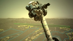 The robotic arm of NASA’s Perseverance rover is visible in this image used by the AI4Mars project. Users outline and identify different rock and landscape features to help train an artificial intelligence algorithm that will help improve the capabilities