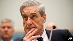 FILE - Then-FBI Director Robert Mueller testifies on Capitol Hill in Washington, June 13, 2013.