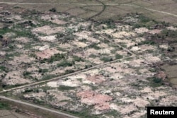 An aerial view shows burned down villages once inhabited by the Rohingya seen from the Myanmar military helicopters that carried the U.N. envoys to northern Rakhine state, Myanmar, May 1, 2018.
